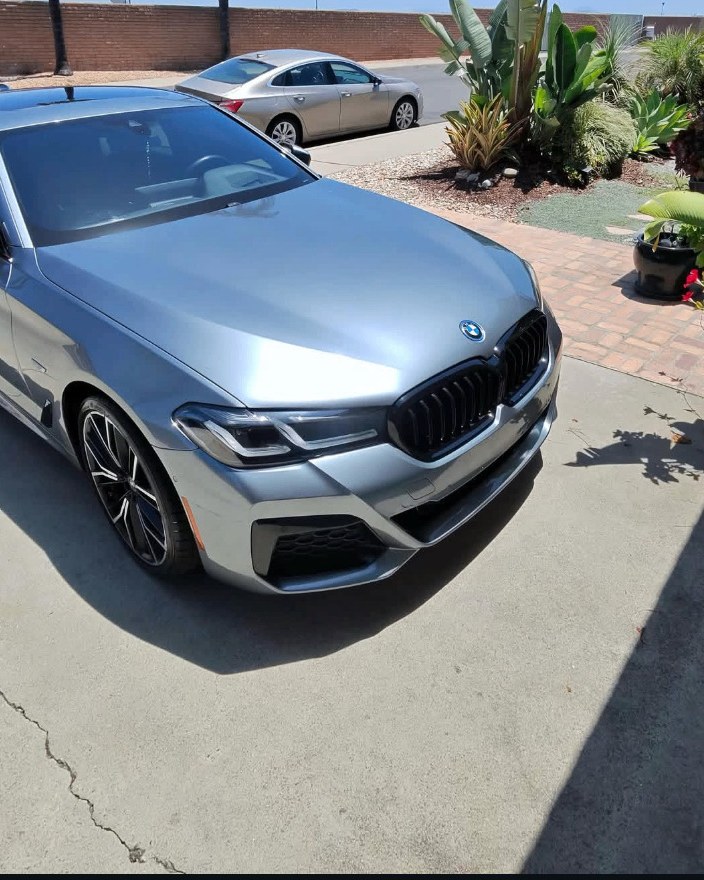 Silver BMW after full foam wash by Kirby's Auto Spa